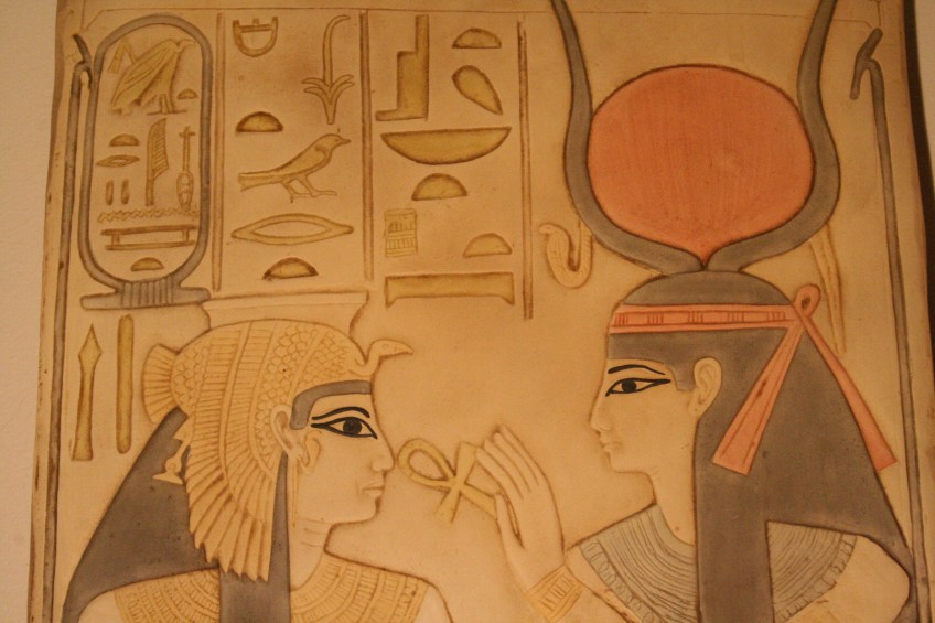 Isis crowned with cow horns and sun disk.