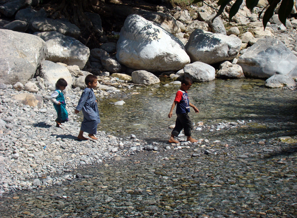 kids playing in a wadi, photo courtesy of Elite Tourism, Oman